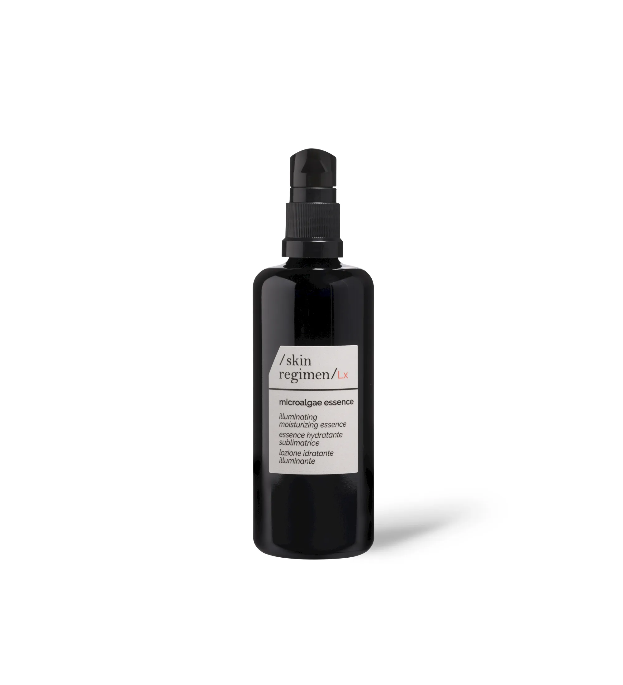 A black skincare essence bottle with a pump on a white background, labeled &ldquo;skin regimen&rdquo; and &ldquo;microalgae essence,&rdquo; featuring an illuminating moisturizing essence claim.