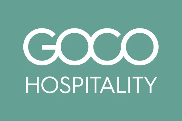 A teal background with large white text reading &ldquo;GOGO HOSPITALITY,&rdquo; in a bold sans-serif style.